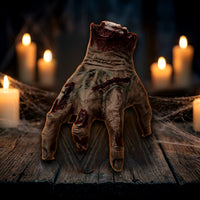 The Electric Walking Hand crawling across a candlelit haunted wood table View 1