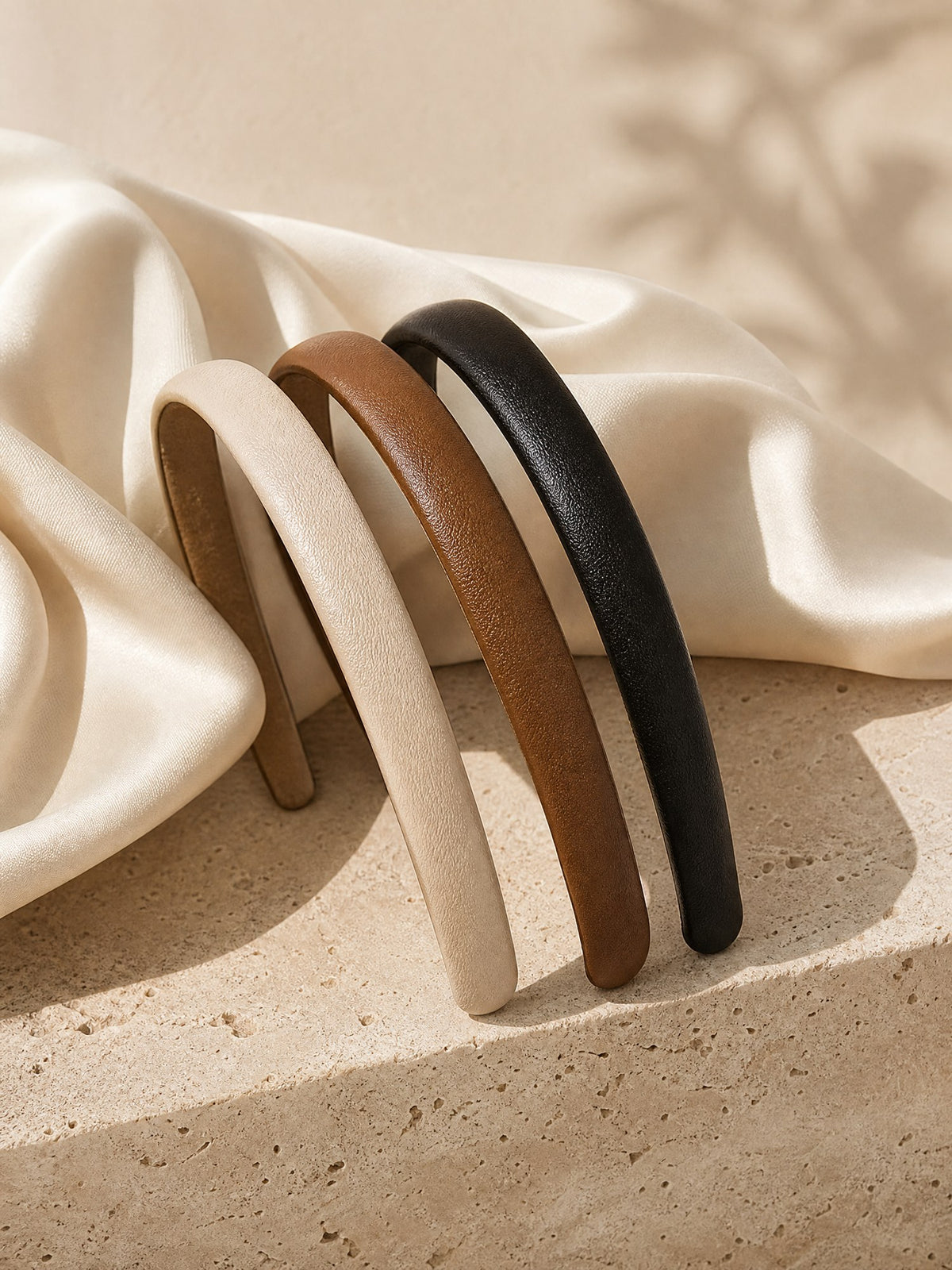 Bandeau Leather Headband, styled on travertine
