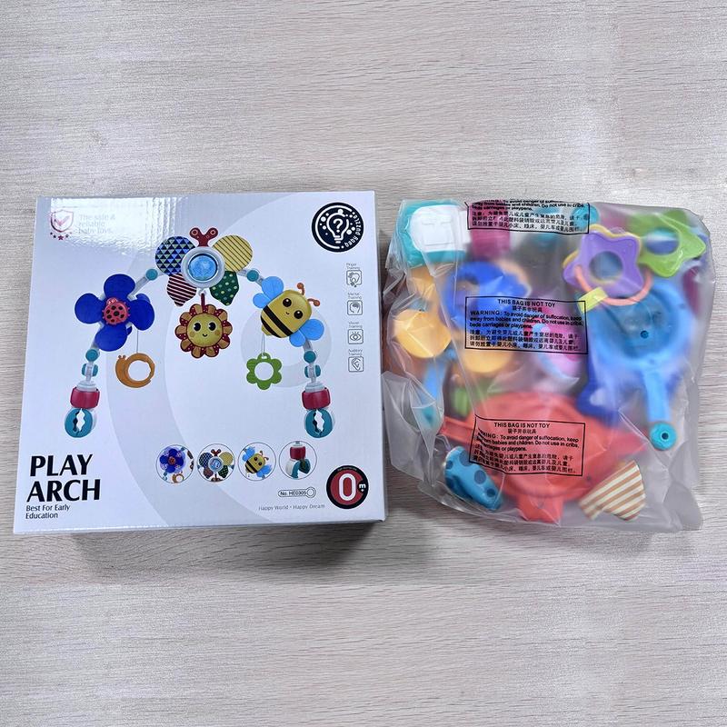 The play arch boxed, with all parts sealed in the bag