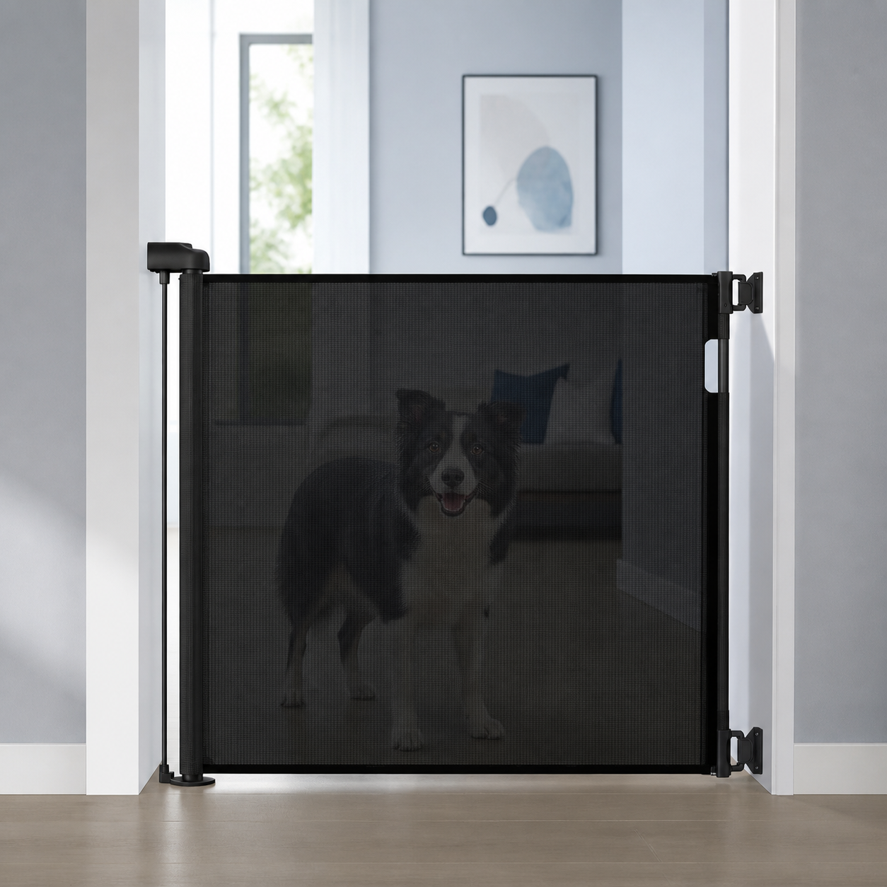 Black retractable pet gate mounted across a doorway with a dog safely behind it