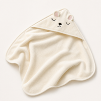 Cream hooded baby bath towel with a sleeping bear face View 1