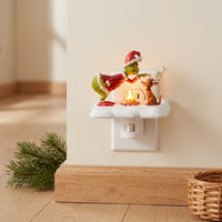 Christmas Grinch and Dog Campfire Plug-In Nightlight in Hallway Outlet View 1