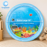 Extra large 30 inch water mat with a printed reef scene, shown on a nursery floor