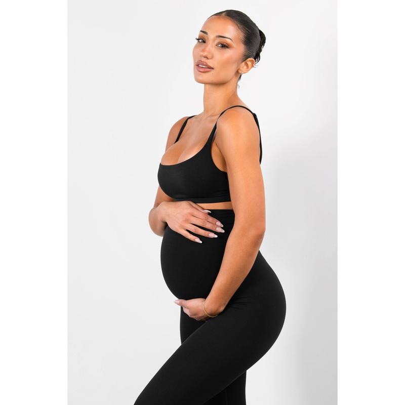 The panel worn over a third-trimester bump, seen from the side